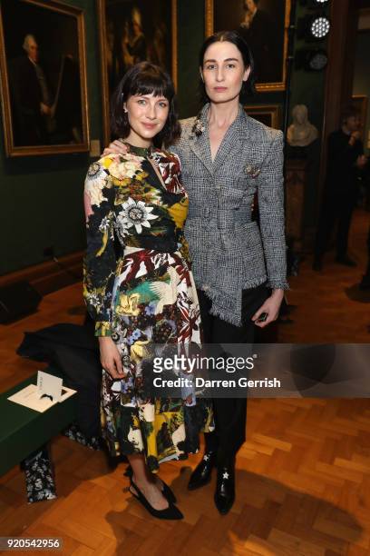 Erin O'Connor and Caitriona Balfe attend the ERDEM show during London Fashion Week February 2018 on February 19, 2018 in London, England.