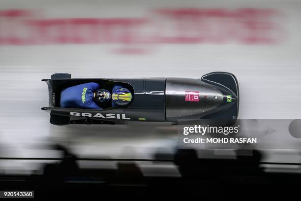 Brazil's Edson Bindilatti and Edson Ricardo Martins compete in the 2-man bobsleigh heat 3 run during the Pyeongchang 2018 Winter Olympic Games, at...