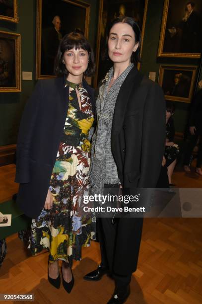 Caitriona Balfe and Erin O'Connor attend the Erdem show during London Fashion Week February 2018 at National Portrait Gallery on February 19, 2018 in...