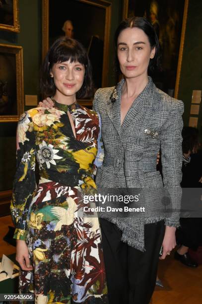 Caitriona Balfe and Erin O'Connor attend the Erdem show during London Fashion Week February 2018 at National Portrait Gallery on February 19, 2018 in...