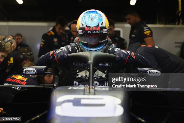 Daniel Ricciardo of Australia prepares to drive the Aston Martin Red Bull Racing Red Bull RB14 TAG Heuer during the Aston Martin Red Bull Racing RB14...