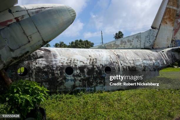 An inoperable Soviet-built Antonov 26 belonging to Cubana Airlines lies near the Pearls Airport runway February 10, 2018 in Saint Andrews, Grenada....