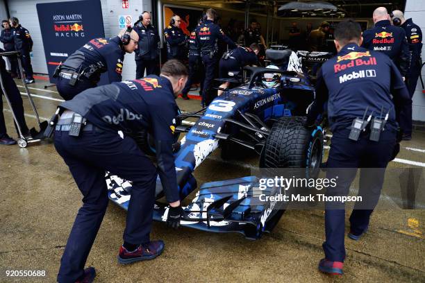 Daniel Ricciardo of Australia prepares to drive the Aston Martin Red Bull Racing Red Bull RB14 TAG Heuer during the Aston Martin Red Bull Racing RB14...