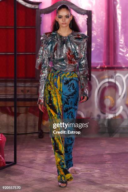 Model walks the runway at the Halpern show during London Fashion Week February 2018 on February 17, 2018 in London, England.