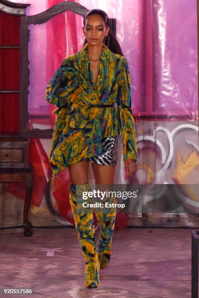 Model walks the runway at the Halpern show during London Fashion Week February 2018 on February 17, 2018 in London, England.