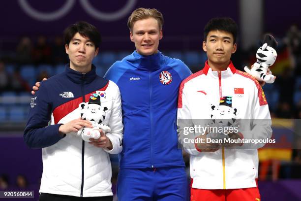 Silver medalist Min Kyu Cha of Korea, gold medalist Havard Lorentzen of Norway and bronze medalist Tingyu Gao of China stand on the podium during the...