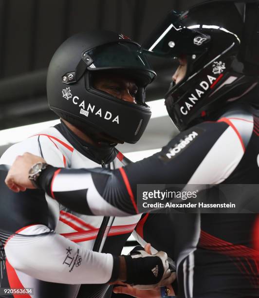 Christopher Spring and Lascelles Brown of Canada embrace after they finish their final run during the Men's 2-Man Bobsleigh on day 10 of the...