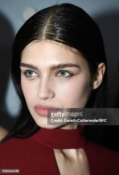 Model backstage ahead of the David Koma show during London Fashion Week February 2018 at St George's Church Bloomsbury on February 19, 2018 in...