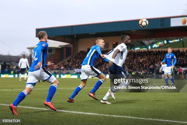 Moussa Sissoko of Spurs has his shirt pulled by Mark Kitching of Rochdale during The Emirates FA Cup Fifth Round match between Rochdale AFC and...