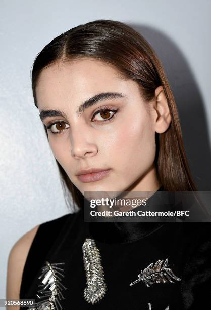 Model backstage ahead of the David Koma show during London Fashion Week February 2018 at St George's Church Bloomsbury on February 19, 2018 in...