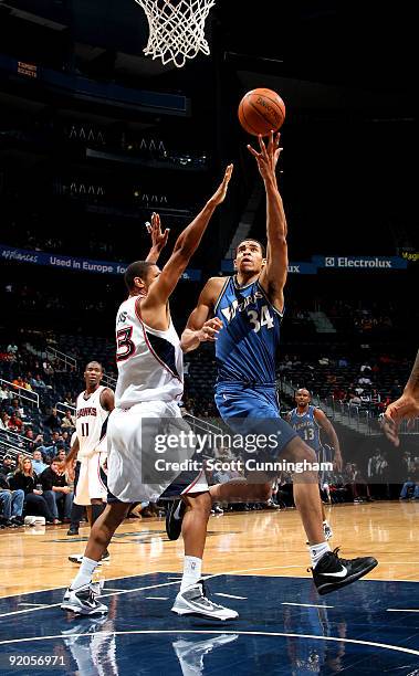 JaVale McGee of the Washington Wizards puts up a shot against Randolph Morris of the Atlanta Hawks during a preseason game on October 19, 2009 at...