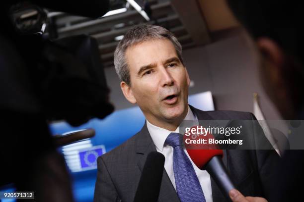 Hartwig Loeger, Austria's finance minister, speaks to journalists as he arrives for a Eurogroup finance ministers meeting in Brussels, Belgium, on...