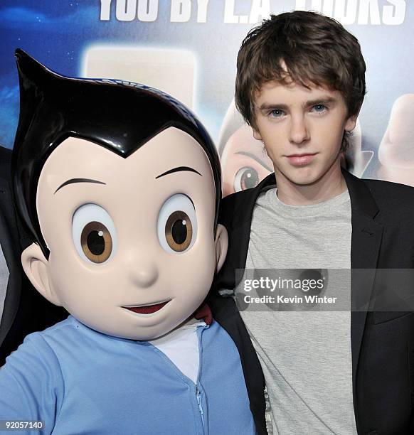 Actor Freddie Highmore poses with Astro Boy at the premiere of Summit Entertainment and Imagi Studios' "Astro Boy" at the Chinese Theater on October...