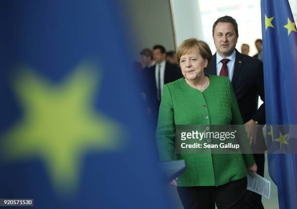 German Chancellor Angela Merkel and Luxembourg Prime Minister Xavier Bettel arrive to give statements to the media following talks at the Chancellery...