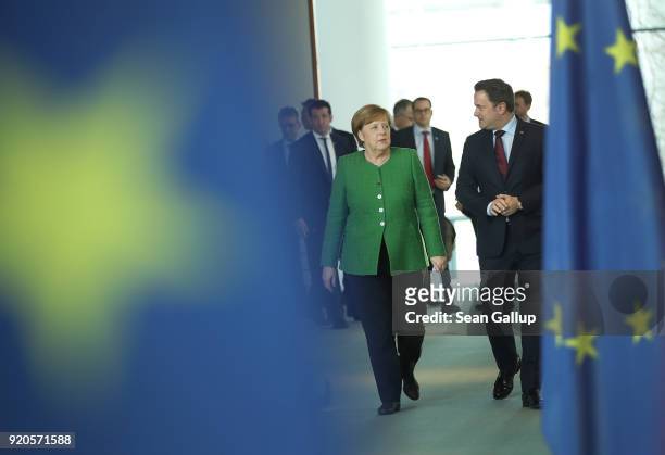 German Chancellor Angela Merkel and Luxembourg Prime Minister Xavier Bettel arrive to give statements to the media following talks at the Chancellery...
