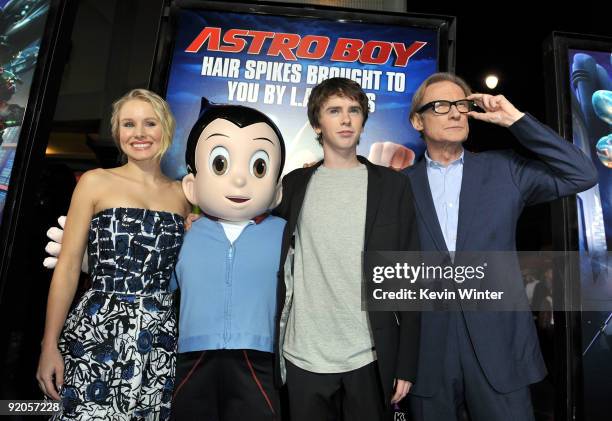 Actress Kristen Bell, Astro Boy, actors Freddie Highmore and Bill Night pose with Astro Boy at the premiere of Summit Entertainment and Imagi...