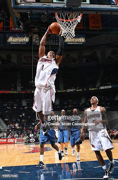 Maurice Evans of the Atlanta Hawks dunks against the Washington Wizards during a preseason game on October 19, 2009 at Philips Arena in Atlanta,...