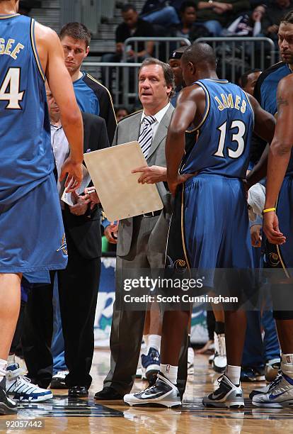 Head Coach Flip Saunders of the Washington Wizards speaks to his team during a preseason game against the Atlanta Hawks on October 19, 2009 at...