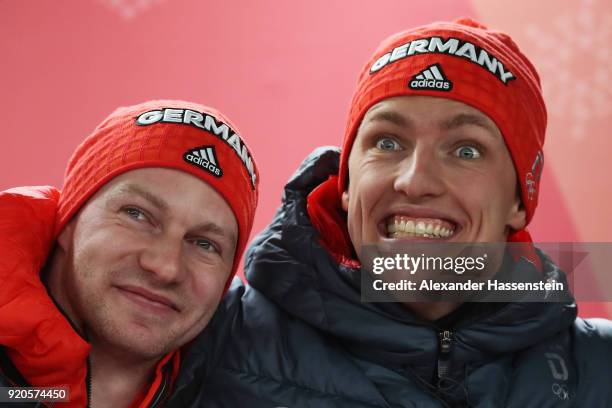 Joint gold medalists Francesco Friedrich and Thorsten Margis of Germany celebrate during the victory ceremony after the Men's 2-Man Bobsleigh on day...