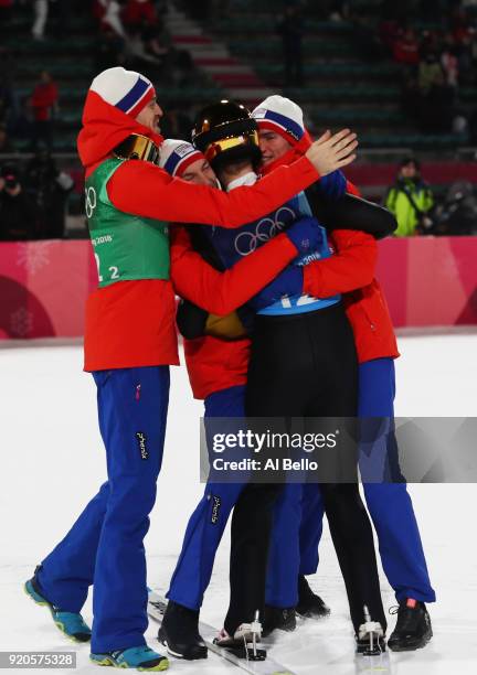 Daniel Andre Tande, Andreas Stjernen, Johann Andre Forfang and Robert Johansson of Norway celebrate winning gold in the Ski Jumping - Men's Team...