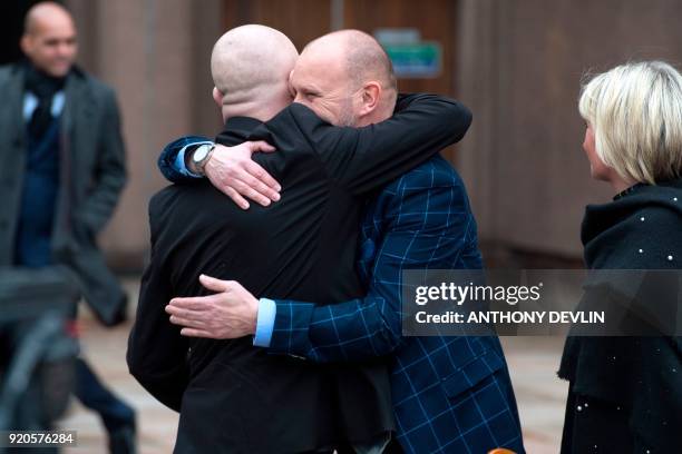 Victims of abuse by former football coach Barry Bennell, Jason Dunsford and Chris Unsworth , embrace outside Liverpool Crown Court on February 19,...