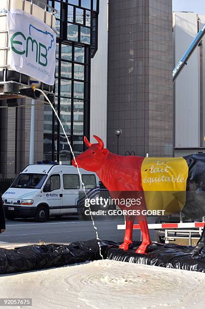 Belgian farmers dump milk in front of EU headquarters in Brussels on September 21, 2009 in Brussels to protest against plummeting milk prices....