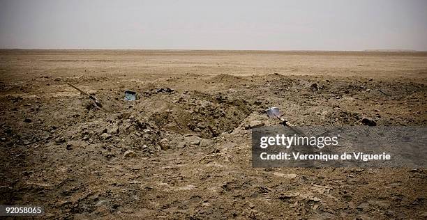 Shovels lie in the dirt after a whole family is caught by the commander of the antiquities police Abdul Fetar and his men, while illegaly digging in...