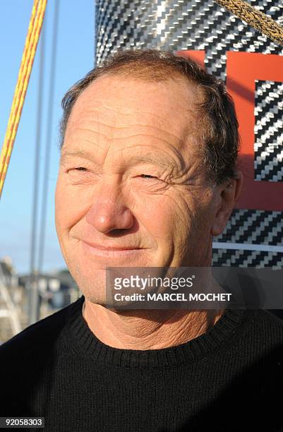 French skipper of the maxi-trimaran "IDEC II", Françis Joyon poses at the La Trinite-sur-Mer harbor, western France, before his departure to set a...