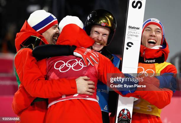 Daniel Andre Tande, Andreas Stjernen, Johann Andre Forfang and Robert Johansson of Norway celebrate winning gold in the Ski Jumping - Men's Team...