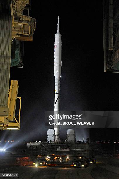 S new Ares 1-X test vehicle leaves the Vehicle Assembly Building early on October 20, 2009 on its way to launch pad 39-B at Kennedy Space Center,...