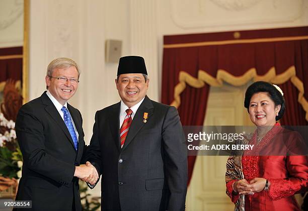 Australia's Prime Minister Kevin Rudd congratulates Indonesian President Susilo Bambang Yudhoyono after he was sworn-in for a second presidential...