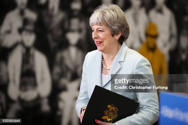 British Prime Minister Theresa May arrives to deliver a speech to students and staff during her visit to Derby College on February 19, 2018 in Derby,...