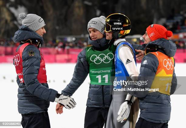 Karl Geiger, Stephan Leyhe, Richard Freitag of Germany and Andreas Wellinger of Germany celebrate their silver medal during the Ski Jumping - Men's...