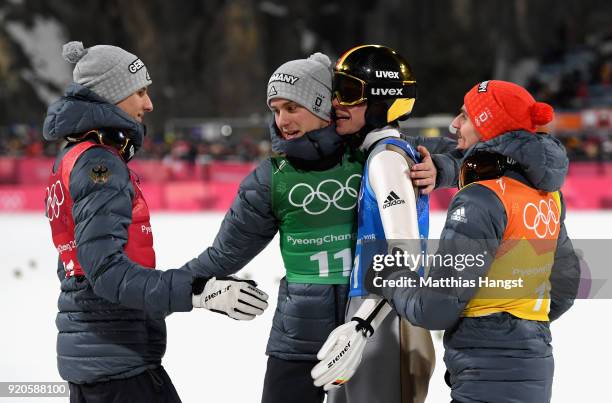 Karl Geiger, Stephan Leyhe, Richard Freitag of Germany and Andreas Wellinger of Germany celebrate their silver medal during the Ski Jumping - Men's...