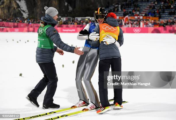 Karl Geiger, Stephan Leyhe, Richard Freitag of Germany and Andreas Wellinger of Germany celebrate their silver medal during the Ski Jumping - Men's...