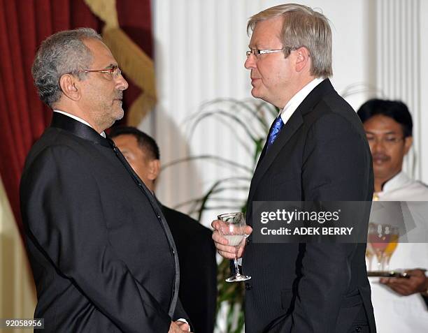 Australian Prime Minister Kevin Rudd talks to East Timor's President Jose Ramos Horta as they attend an event on the occassion of the inaugeration of...