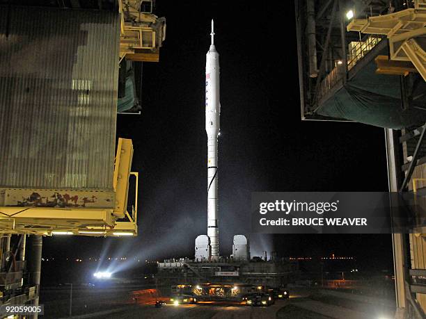 S new Ares 1-X test vehicle leaves the Vehicle Assembly Building early on October 20, 2009 on its way to launch pad 39-B at Kennedy Space Center,...