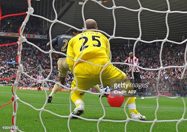 Sunderland's English forward Darren Bent shoots and his shot hits a red beach-ball and deflects into the net for the only goal of the English Premier...