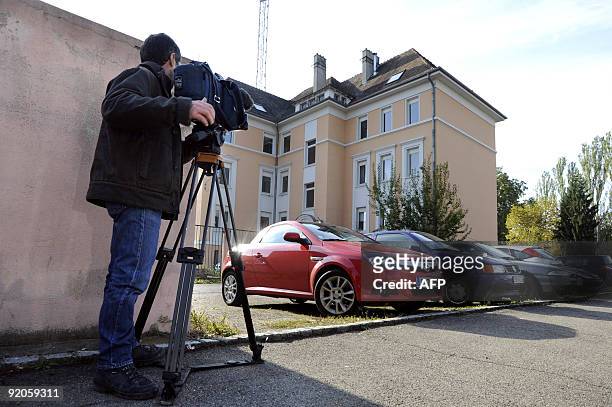 Reporter films the police building in Mulhouse on October 20 where Frenchman Andre Bamberski father of Kalinka Bamberski who was allegedly raped and...