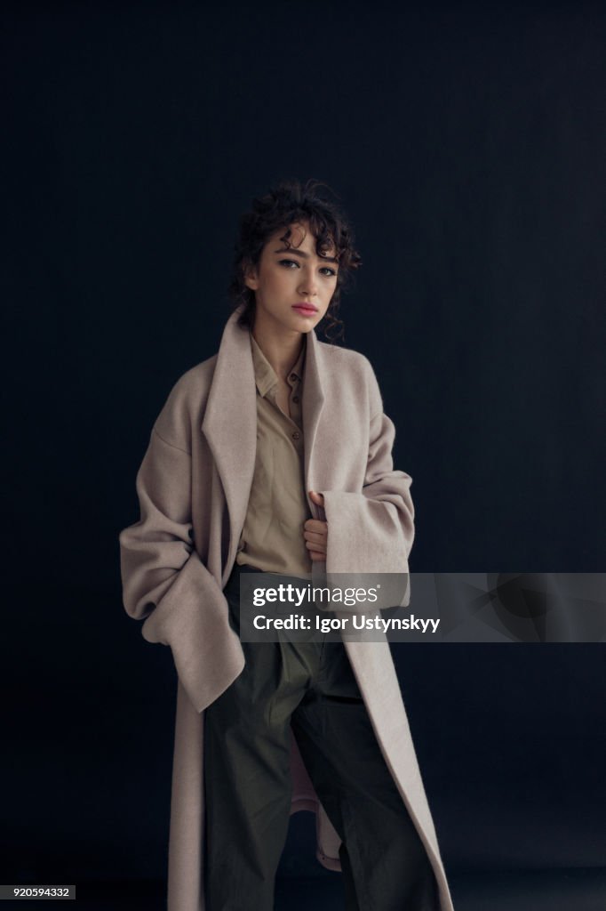 Young beautiful woman on dark background