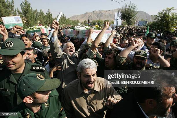 Iranians carry the coffin of General Nur-Ali Shushtari, deputy commander of the Revolutionary Guards ground forces and other members of the...