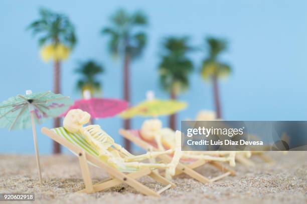 caribbean beach full of esqueleton enjoying - human skeleton ground stock pictures, royalty-free photos & images