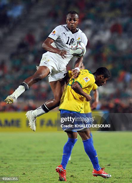 Ghana's Andre Ayew jumps over Brazil's Douglas Costa during their FIFA U-20 World Cup final match in Cairo on October 16, 2009. AFP PHOTO/KHALED...