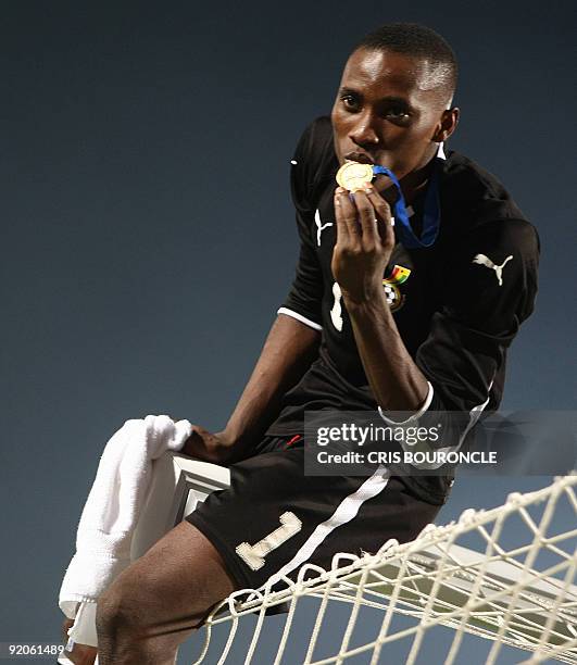 Ghana's goalkeeper Daniel Agyei kisses his gold medal after winning the FIFA U-20 World Cup final football match in Cairo on October 16, 2009. Ghana...