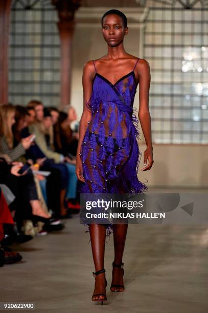 Model presents a creation from designer David Koma during their catwalk show on the fourth day of London Fashion Week Autumn/Winter 2018 in London on...