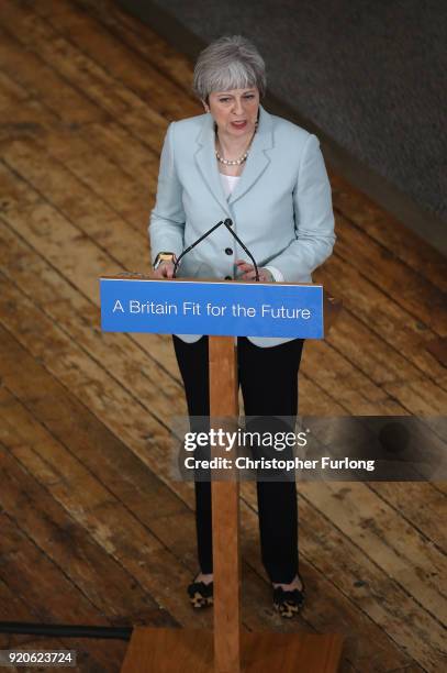 British Prime Minister Theresa May delivers a speech to students and staff during her visit to Derby College on February 19, 2018 in Derby, England....