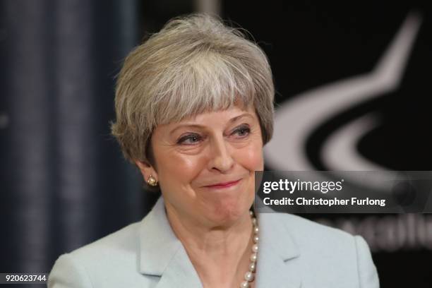 British Prime Minister Theresa May delivers a speech to students and staff during her visit to Derby College on February 19, 2018 in Derby, England....