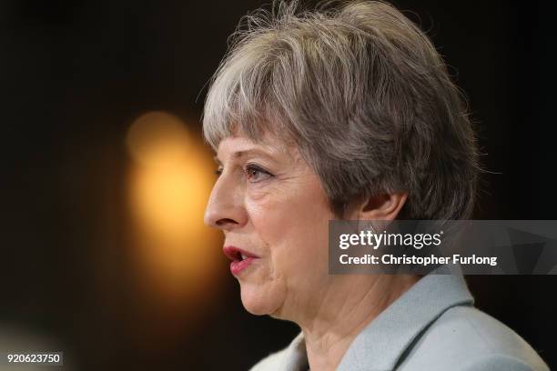 British Prime Minister Theresa May delivers a speech to students and staff during her visit to Derby College on February 19, 2018 in Derby, England....