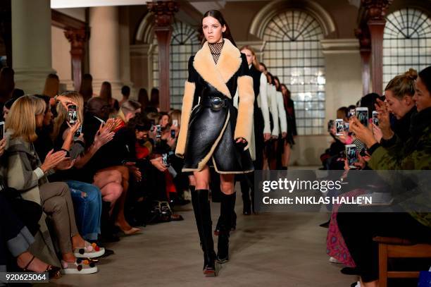 Models present creations from designer David Koma during their catwalk show on the fourth day of London Fashion Week Autumn/Winter 2018 in London on...