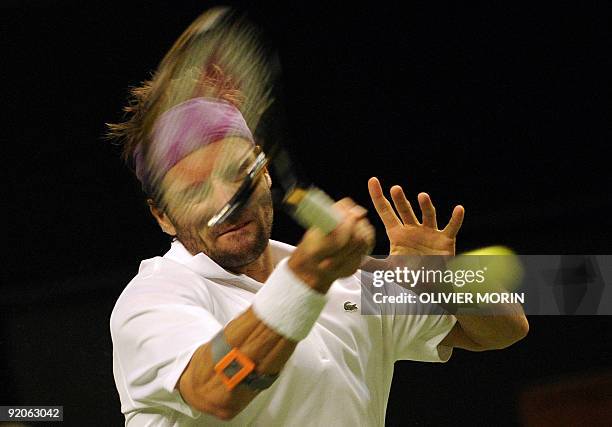 France's Arnaud Clement plays a shot during his match against Germany's Andreas Beck in Stockholm on October 19 at the 1st day of Tennis Stockholm...